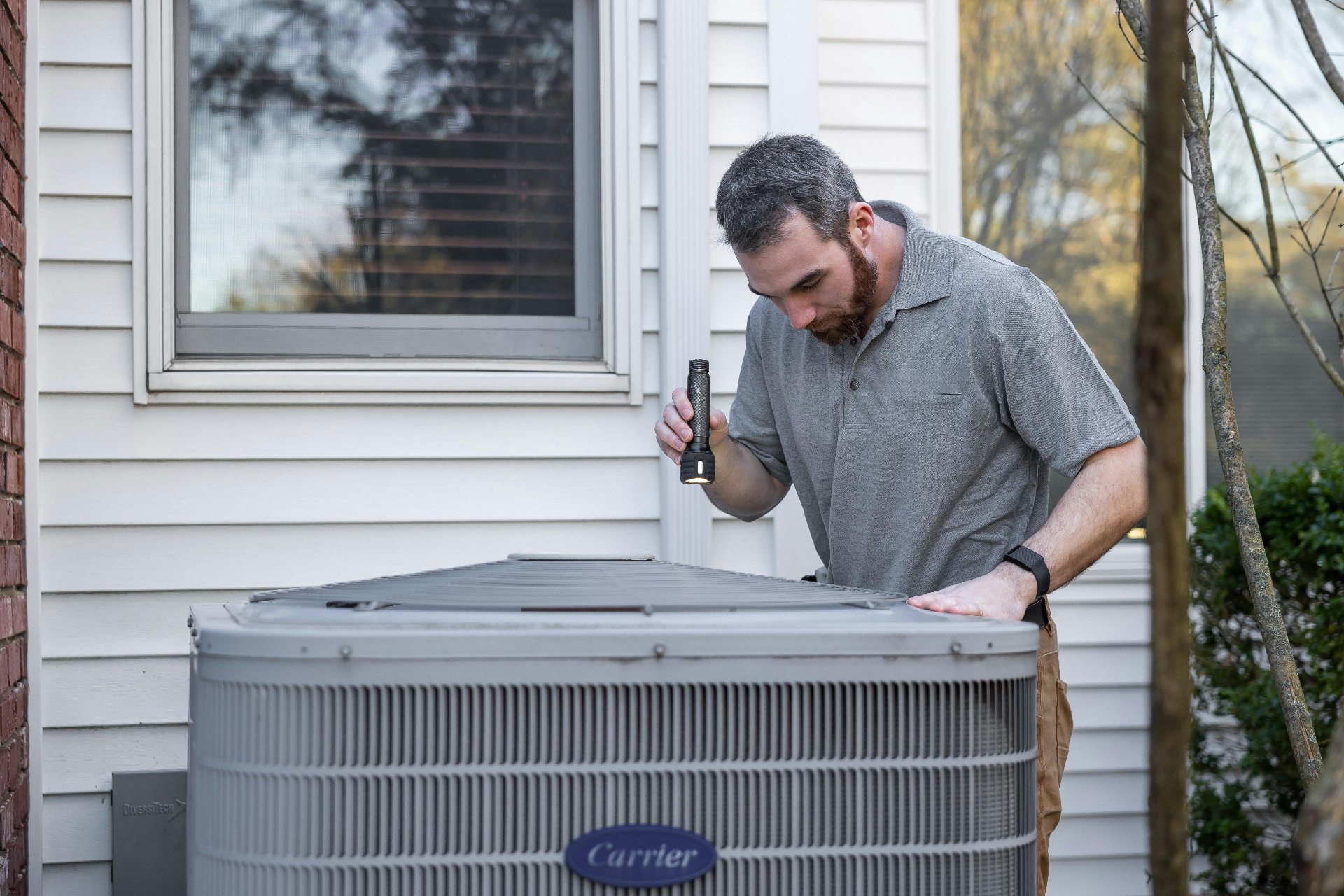 HVAC technician inspecting equipment